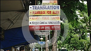 Humorous street sign about marriage for aliens on silom road in bangkok