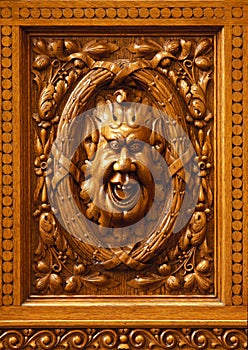 Humorous wooden carved face.