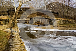 Humpback Covered Bridge Over a Frozen Stream