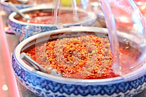 Hunan specialty chili sauce on a blue plate