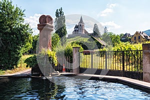 hunawihr old fountain and church