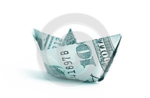 Hundred dollar banknote folded as a boat, finance concept