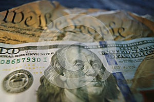 Hundred dollar bill on US Constitution