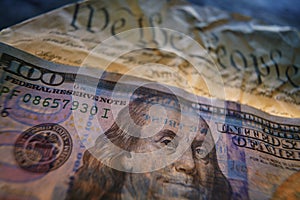 Hundred dollar bill on the US Constitution