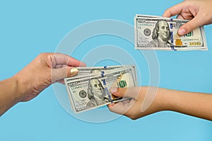 Hundred-dollar bills in female hands. The concept of corruption. to give a bribe. Give or take dollars. Hands with dolars 
