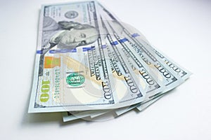 Hundred-dollar bills on a white background. Finance, Economics