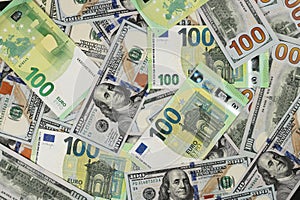 Hundred dollars and euros bills. Finance concept background