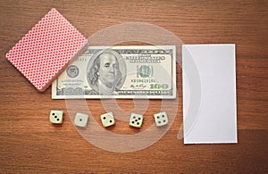 Hundred dollars and playing cards