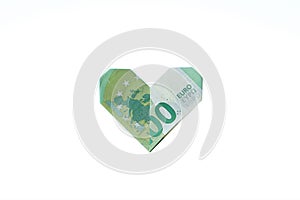 Hundred euro banknote formed to a origami heart.