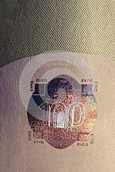 Hundred euro banknote protective hologram macro. The euro is currently the second most used currency in the world