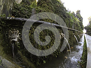 The Hundred Fountains Cento Fontane in the beautiful gardens of Villa D`Este, in Tivoli, Italy. Walk a hundred fountains