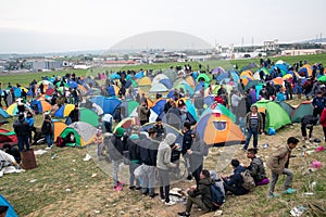 Hundreds of migrants and refugees gathered outside of a refugee camp in Diavata