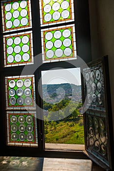 HUNEDOARA, ROMANIA:Open window. View of the beautiful summer landscape, view from the castle Corvin Castle