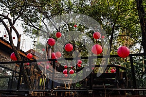 Hung with red lanterns in the open-air teahouse.