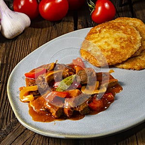 Hungarian goulash with potato pancakes