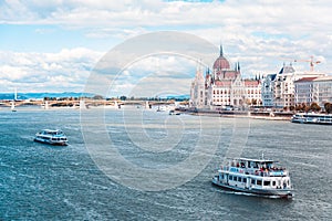 The Hungarian Parliament builded on the riverside of the Danube, on which the ship sails.