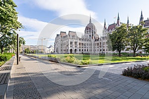 Hungarian parliament building and park from behind on a sunny day in summer season, angled view in Budapest, Hungary