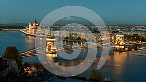 Hungarian Parliament, and the Chain bridge Szechenyi Lanchid, over the River Danube, Budapest, Hungary, at night