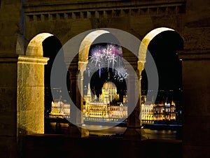 Hungarian Parliament through Fishermans bastion with fireworks