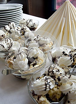 Hungarian whipped cream sweets on a laid table