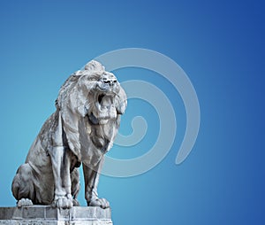 Hungary. Budapest. A large stone lion, growls open its mouth