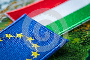 Hungary and european union patches overlapping on europe map, concept of cooperation between union countries, flags of hungary and