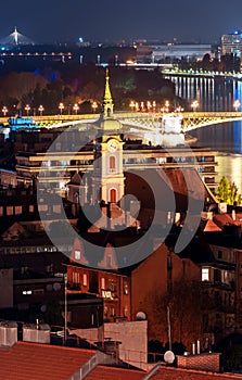 Hungary, evening twilight in Budapest, church on the background of night city lights, cityscape