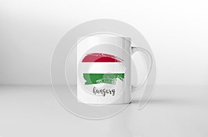 Hungary flag on white coffee mug.