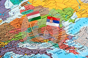 Hungary and Serbia flag pins on map, neighbouring countries, political allies, concept image