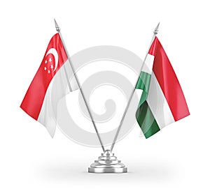 Hungary and Singapore table flags isolated on white 3D rendering