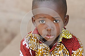 Hunger Africa Symbol - Little African Boy with Rice on Mouth photo