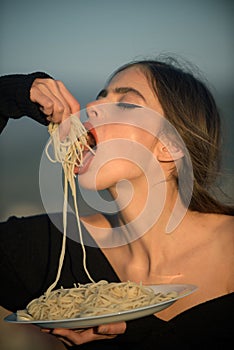 Hunger, appetite, recipe. Diet and healthy organic food, italy. Woman eating pasta as taster or restaurant critic. Chef