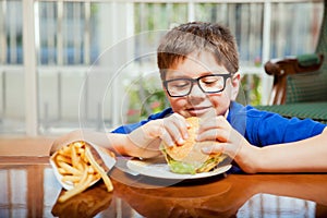 Hungry boy with a hamburger