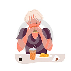 Hungry girl eating burger in fast food restaurant or cafe, young person with unhealthy diet