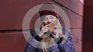Hungry girl eats bread