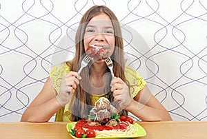 Hungry girl eats meatball