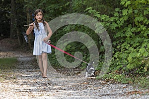 A Hungry Homeless Abandoned Runaway Child Looks For Food And Shelter With Her Little Dog