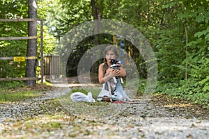 A Hungry Homeless Abandoned Runaway Child Looks For Food And Shelter With Her Little Dog