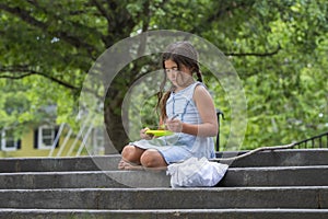 A Hungry Homeless Abandoned Runaway Child Looks For Food And Shelter While Holding An Empty Plate Of Food