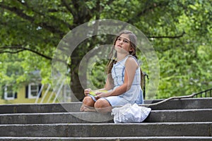 A Hungry Homeless Abandoned Runaway Child Looks For Food And Shelter In An Outdoor Environment