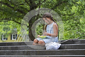 A Hungry Homeless Abandoned Runaway Child Looks For Food And Shelter In An Outdoor Environment