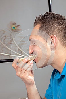 Hungry man eating a wholewheat roll