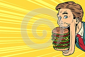 Hungry man with a giant Burger, street food