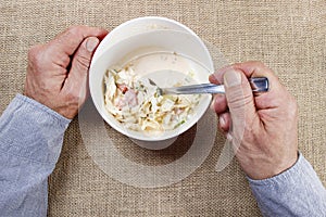 Hungry man over his meal.