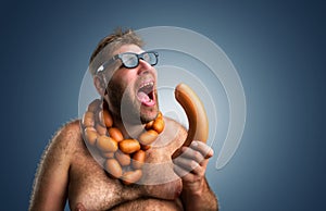 Hungry man with sausages