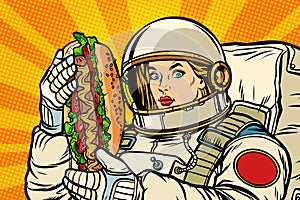 Hungry woman astronaut with hot dog