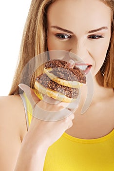 Hungry woman with a donut
