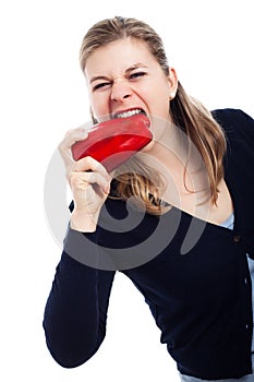 Hungry woman eating paprika