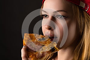 Hungry woman eating pizza