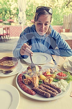 Hungry woman waiting to start eating her dish.